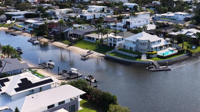 Aerial View of Luxury Waterfront Mansions Along a Coastal Canal