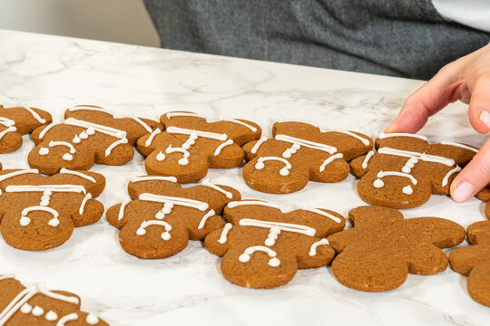Decorating Gingerbread Man Cookies with Royal Icing for Festive Occasions