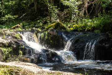 Obraz premium Small waterfall of the Wolfsteiner Ohe in Buchberger Leite gorge near Freyung, Bavaria, Germany