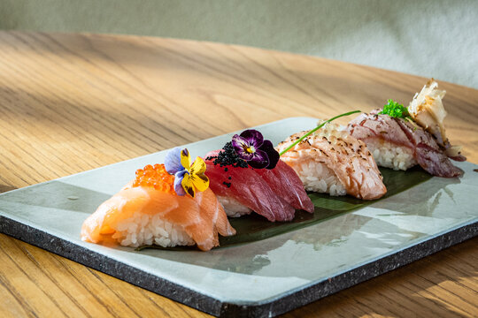Assorted Sushi on Elegant Plate. Colorful Sushi on Ceramic Plate