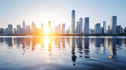 Obraz premium City skyline reflecting on calm water during golden hour, modern skyscrapers illuminated by setting sun, urban cityscape