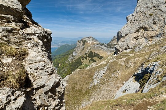View of the Roches du Varo limestone rock ridge while walking on La Tournette mountain. Haute Savoie. France. Europe.
