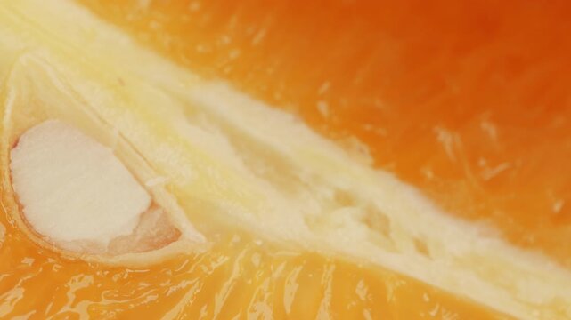 Orange slice segment close up rotating camera motion stock footage