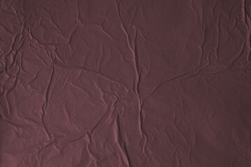 Fototapeta premium Crumpled black red texture background with matte wrinkled surface