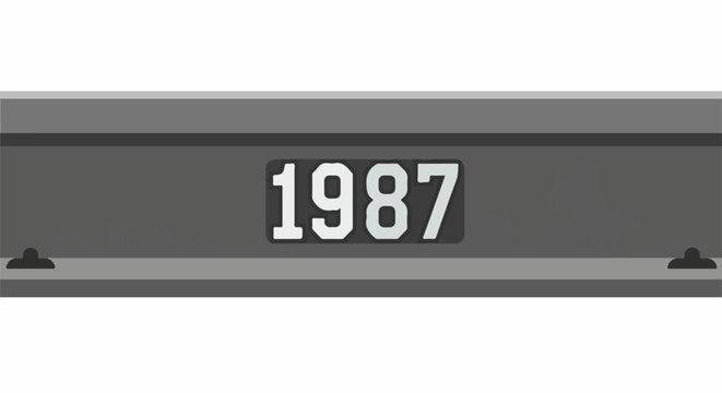 A gray industrial box with the year 1987 displayed prominently in white