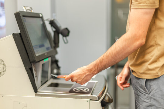 Customer scanning product at self checkout kiosk in supermarket. Contactless retail technology, automated payment system, modern shopping