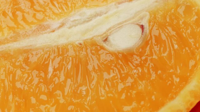 Orange slice segment close up rotating camera motion stock footage