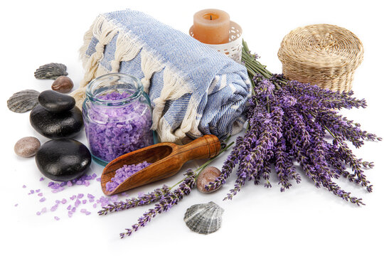 Spa still life with black stone and lavender salt isolated on white background.
