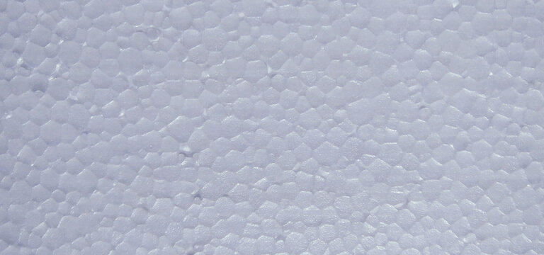 close-up view of a white styrofoam surface, displaying its detailed, bumpy, and cellular texture structure