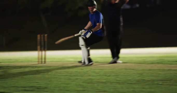 Man batsman after shot sprinting, keeper throwing stumps running out teenage boy