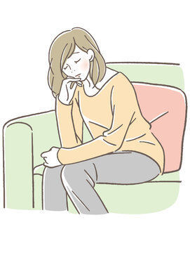 目を瞑って座る女性
