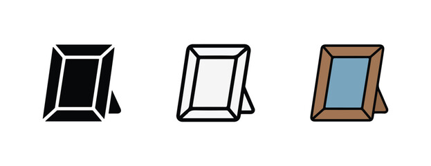 picture frames in various colors and designs for holding photographs or artwork  black and white and brown frames with rectangular shapes and stands © Alex