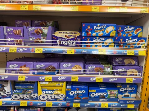 Calvia, Spain - June 07, 2026: Shelves stocked with various chocolate products including Milka, Oreo, and Principe in a grocery store aisle