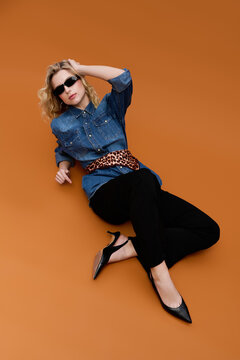 Showcasing denim style with confidence and elegance in a trendy setting