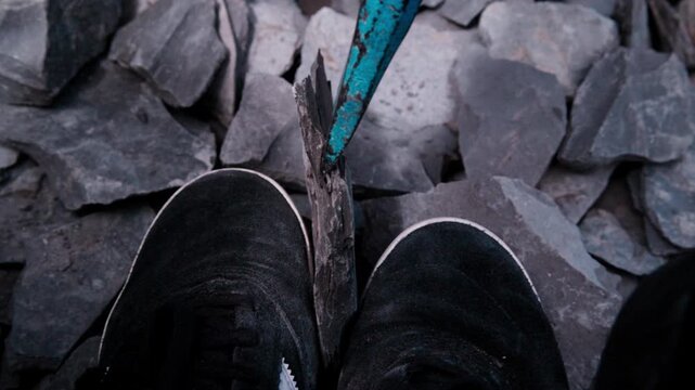 Super slow motion at 180fps: extreme close-up of the chisel tip as a large piece of Jurassic shale breaks away. Every detail of the split &ndash; the dramatic moment of fossil hunting in Holzmaden, Germany.