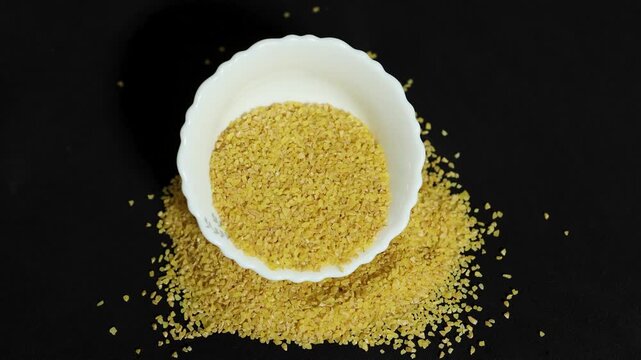 healthy whole grain bulgur wheat in bowl highlighting nutritious pantry staple
