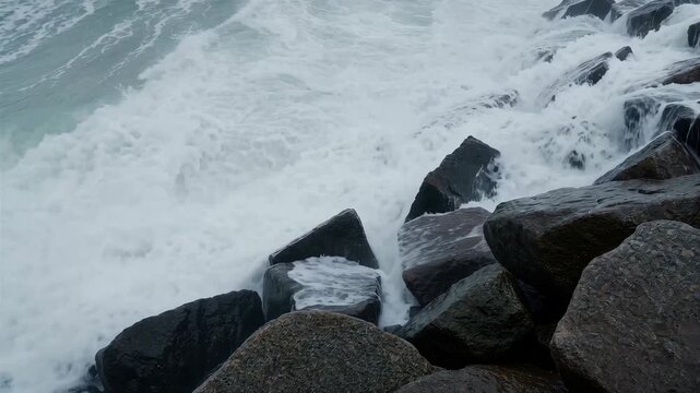 Ocean Wave Wash on Sloped Riprap Rocks
