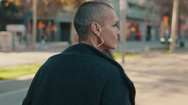 Confident Modern Woman Walking on Urban City Street