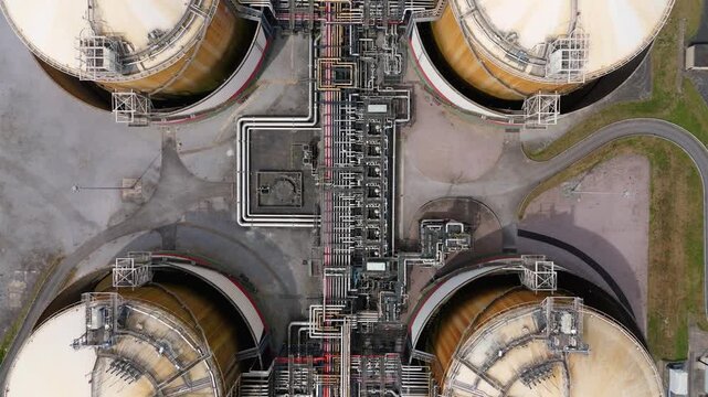 Aerial view of the complex piping and storage tanks at the Liquified Natural Gas LNG Terminal in Isle of Grain, England, United Kingdom.
