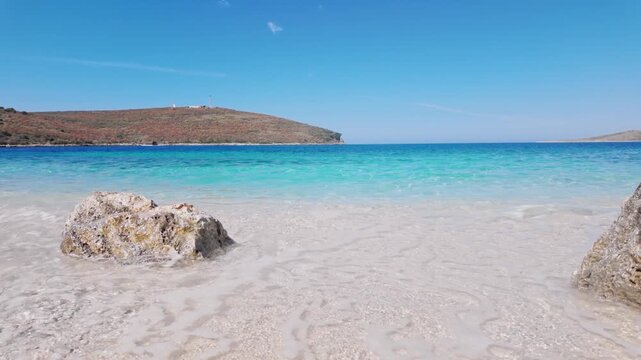 Seashore White Pebble Beach Turquoise Water And Mountain Coast View, Himare - Albania.