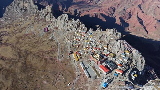 Aerial Drone View of Zizhu Monastery (Tsudrug temple) Nestled in Rocky Tibetan Mountains