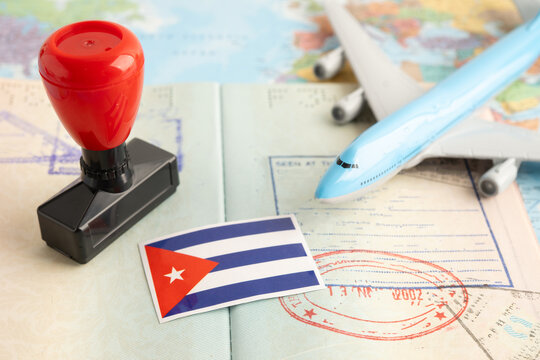 Cuba flag with passport and airplane for travel.