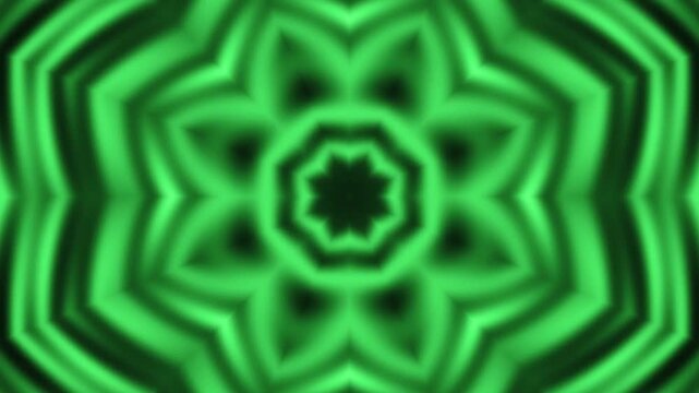 Green and black kaleidoscopic flower pattern with concentric rings glowing symmetrically