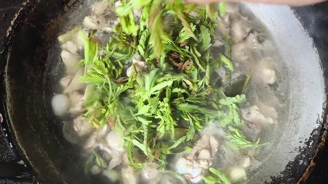 Cooking Tom Kha Gai in pan, Thai famous food.