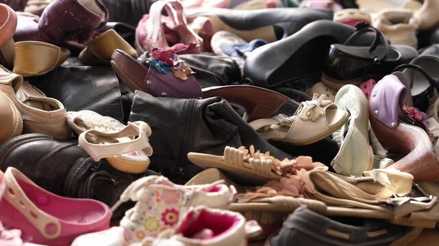 Worn shoes from fast fashion overconsumption