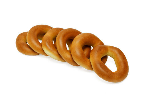 Golden ring-shaped breads lie in a row