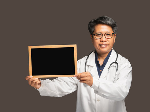 Female doctor holding blank board for health message
