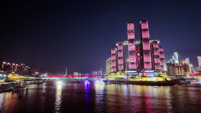 Illuminated Raffles City Chongqing Complex At Night In Chaotianmen Square In The Yuzhong District, China. Aerial Wide Shot