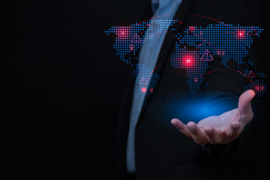 Cautious businessman holding digital world map showing global emerging market risk with serious concern for financial future
