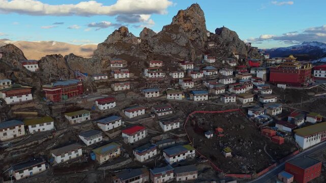 Drone Pan Revealing Zizhu Monastery Among Sacred Cliffs in Tibet