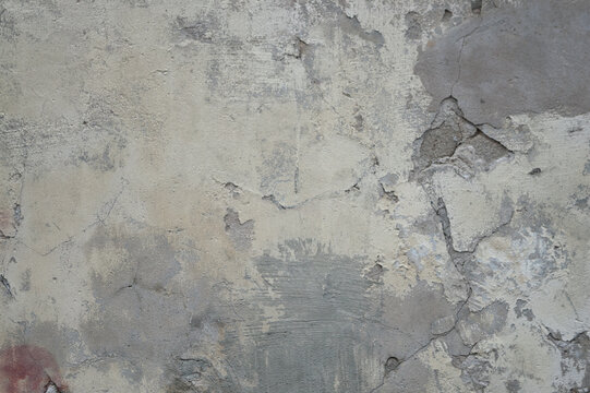 Gray background, photo shows the texture of a wall filled with gray plaster and cement