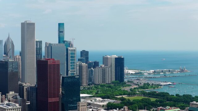 Urban landscape showcasing Chicago downtown skyline with modern skyscrapers, Grant Park, Navy Pier, and Monroe Harbor on Lake Michigan