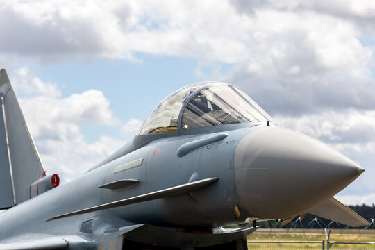 Modern fighter 4th generation jet airfield sleek aerodynamic nose transparent cockpit canopy dramatic clouds sky. Advanced military aviation speed precision defense  engineering innovation
