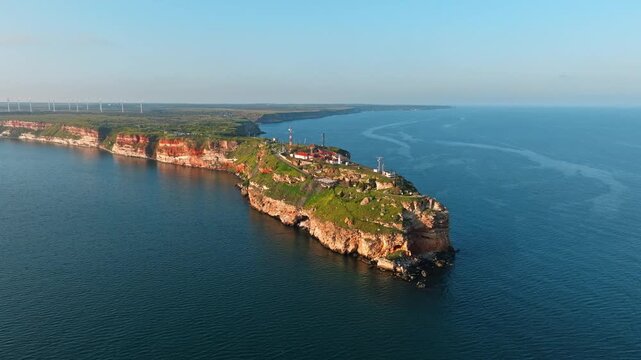 Cape Kaliakra full panoramic aerial drone Black Sea Bulgaria red rocky headland lighthouse cliffs slow motion dramatic seascape travel nature tourism landmark coastline