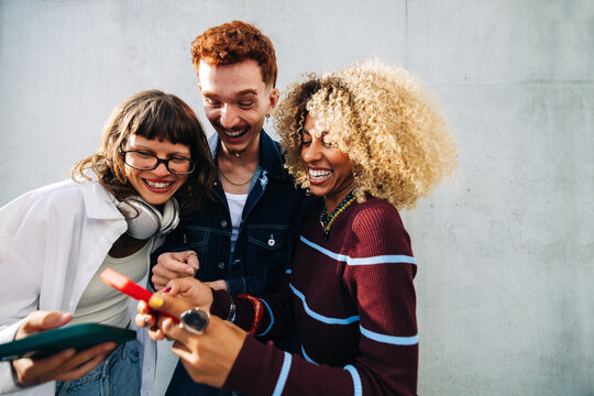 Young friends laughing together in a small group