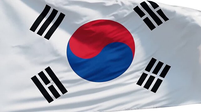 The national flag of South Korea, the Taegeukgi, waving gently in the wind, showcasing its iconic red and blue yin-yang symbol and black trigrams