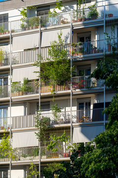apartment buildings in Nordbahnviertel Vienna Austria show balconies and greenery across a layered facade of windows and urban housing in late daylight