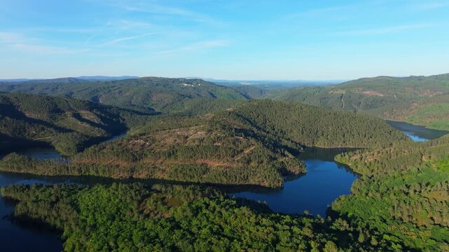 Avia River Through Lush Green Valley From Mirador de San Vicente In Avi&oacute;n, Ourense Province Of Galicia, Spain. Aerial Drone Shot