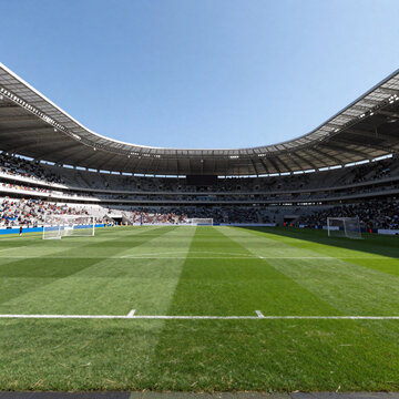 Glitch Art Stadium Ukraine. Soccer Stadium With Lush Green Grass And Clear Blue Sky
