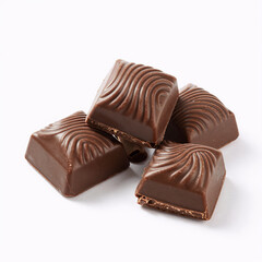 Naklejka premium African Tribal Art Chocolate Group. Milk Chocolate Pieces Against A White Background