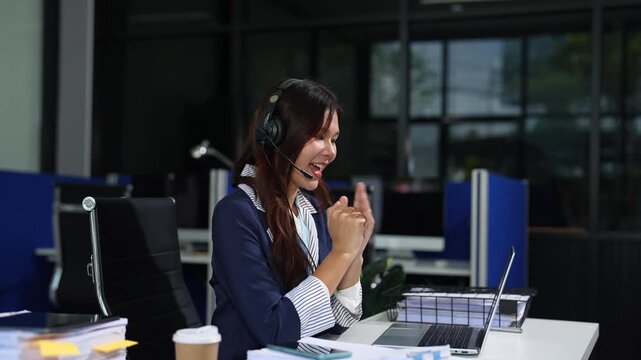 Asian businesswoman presenting ideas and analyzing financial charts during an online meeting.