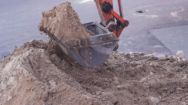 Heavy Excavator Bucket Digging Trench for Urban Infrastructure Renewal