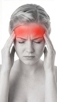 Portrait of a young woman touching her head suffering from a severe migraine headache