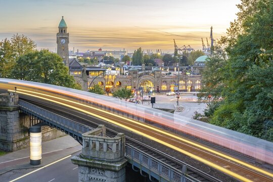 Long exposure at the golden hour at the Landungsbr&uuml;cken with the underground line U3 in the foreground, Hamburg, Germany
