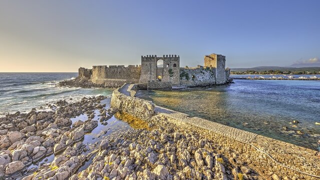 A picturesque old castle on the coast at sunset, sea fortress Methoni, Peloponnese, Greece