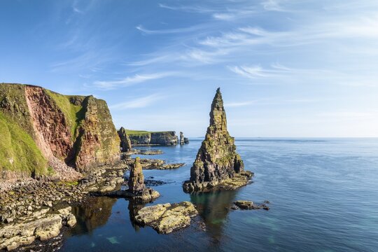 Aerial view of the rugged coastal landscape with the Duncansby Stacks, Duncansby Head coast, County Caithness, Scotland, United Kingdom